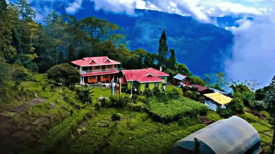 Picturesque view of Sittong village in North Bengal, famous for its orange orchards, misty hills, and serene Himalayan landscape.